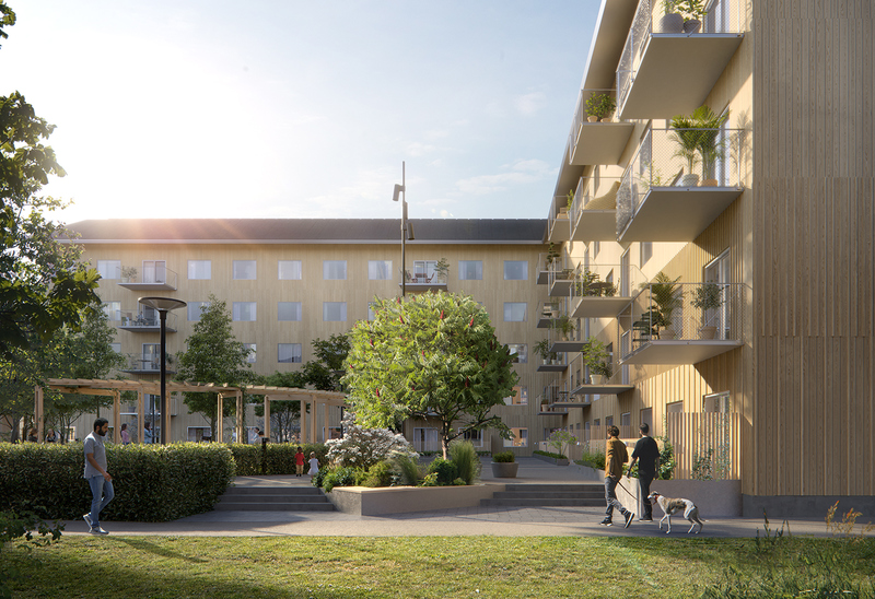 En innergård omgiven av moderna flerfamiljshus med balkonger. Gården är grönskande med träd, buskar och en pergola. Människor promenerar och umgås, och en person går med en hund. Solen skiner och skapar en varm och inbjudande atmosfär.