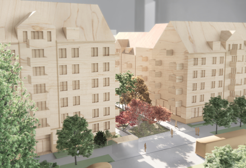 Trämodell av ett bostadskvarter med flera flerbostadshus, träd och en innergård med gångvägar.