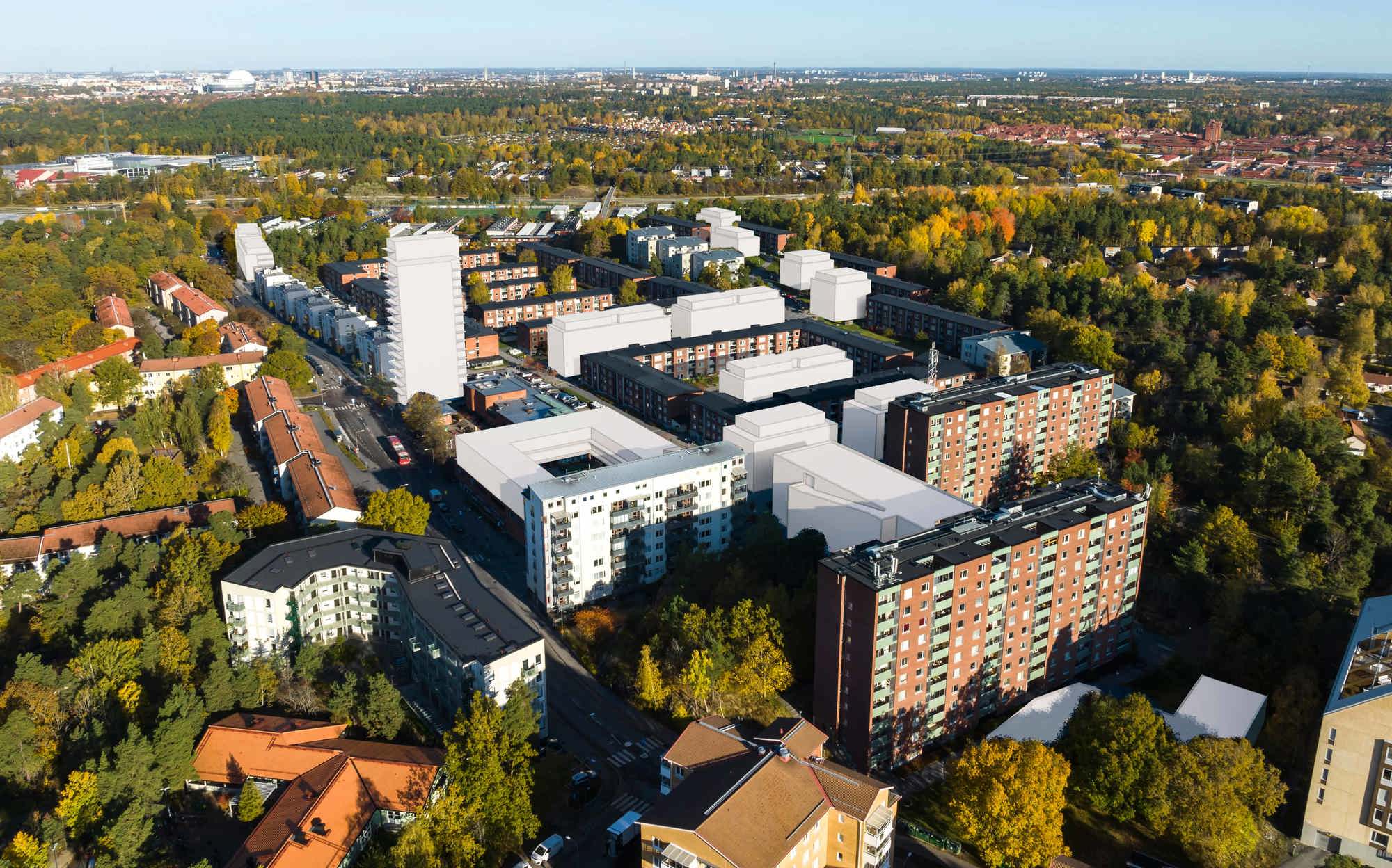 Drönarvy över sköndal uppifrån med inritade vita block som tänkta kommande byggnader